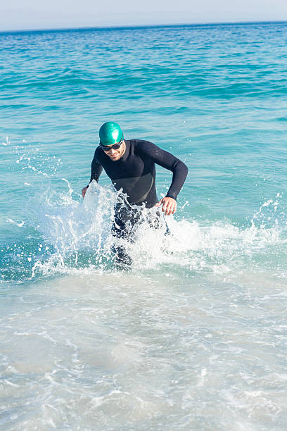 istock Swimmer running in the ocean 482573510