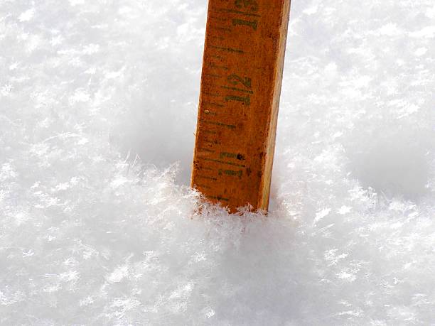 istock Over Ten Inches of Fresh Winter Snow Fall being Measured 482573516