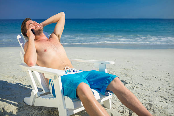 istock Man having phone call at the beach 482576806