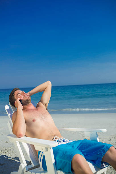istock Man having phone call at the beach 482576808