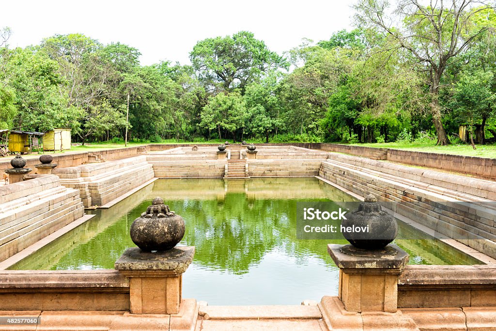 Kuttam Pokuna in Sacred city of Anuradhapura Kuttam Pokuna or the twin ponds in Sri Lanka. These two ponds belong to the Abayagiri aramic complex and probably been used by the monks for bathing. They were build during the reign of King Aggabodhi I (575-608). 2015 Stock Photo