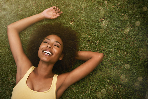 Shot of a young woman laughing while relaxing on the grasshttp://195.154.178.81/DATA/i_collage/pi/shoots/783692.jpg