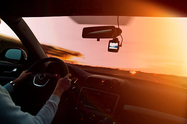 istock Driving at sunset with video recorder 482582340