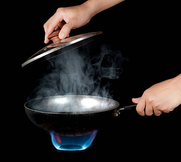 istock Chef cooking with flame in a frying pan 482582698