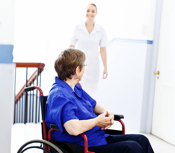 istock Here's my lovely nurse! Elderly patient greets smiling attendant 482583555
