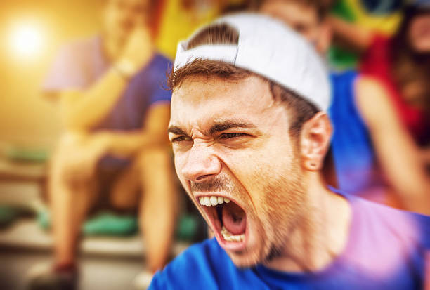 istock Group of sport supporters: man screaming loudly 482585451