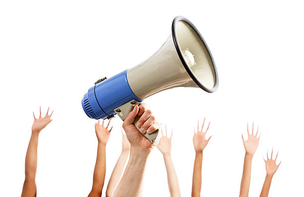 istock I want to talk! Many hands grabbing loud hailer 482586025