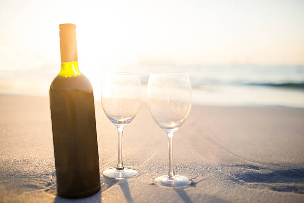 istock bottle of vine with two glass 482586276
