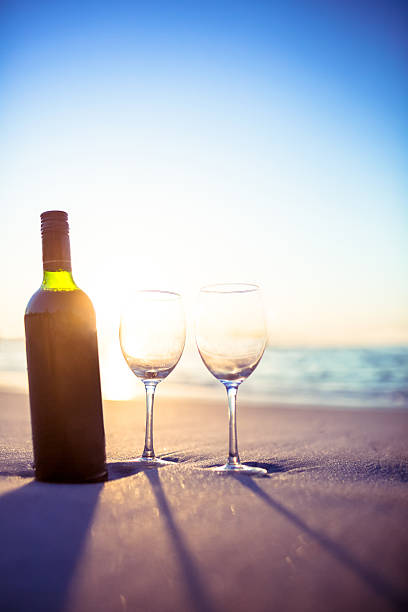 istock bottle of vine with two glass 482586280