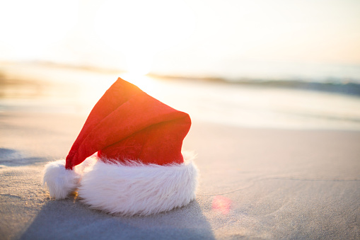 Santa hat on the beach on a sunny day