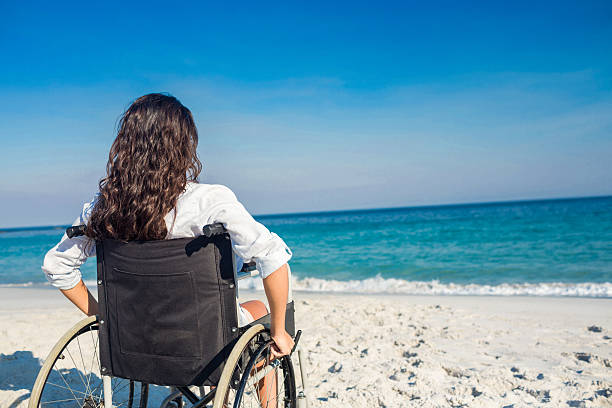 istock Disabled woman looking at the ocean 482587660