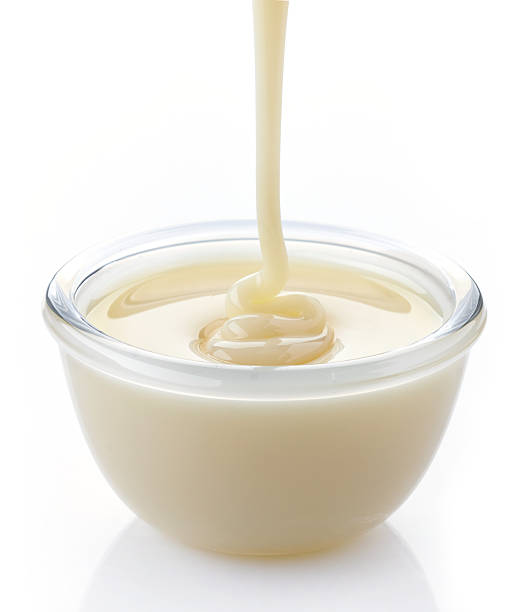 istock pouring condensed milk with sugar in a bowl 482588103