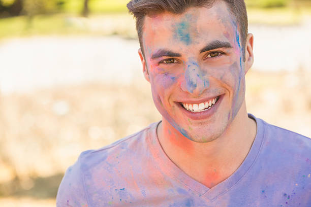 istock Young man having fun with powder paint 482588536