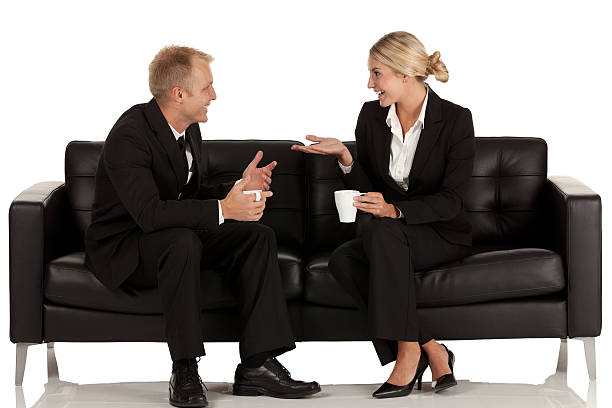 Business executives sitting on couch