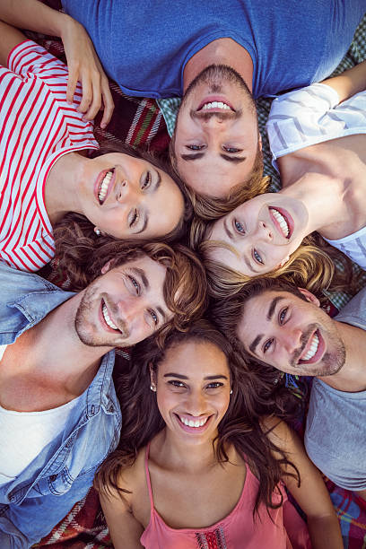istock Happy friends huddling in cirlce 482589244