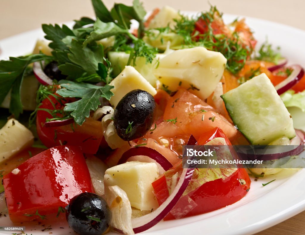 Greek salad Greek salad with feta cheese, olives and vegetables 2015 Stock Photo