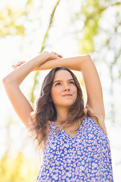 istock Pretty brunette standing arms raised 482590928