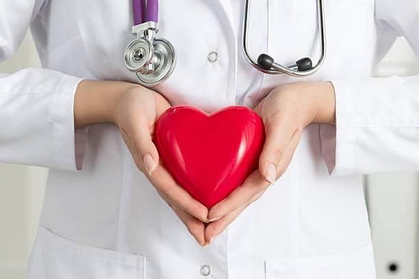 istock Female doctor's hands holding red heart 482594358