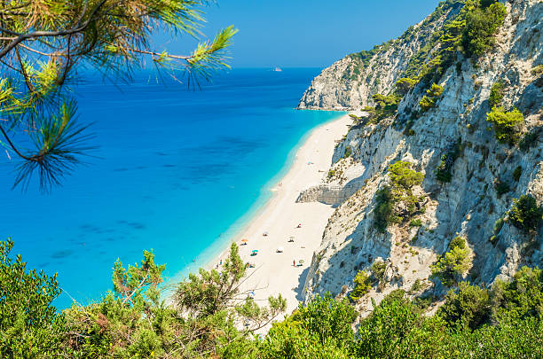 Egremni beach, Lefkada island, Greece Large and long beach with turquoise water on the island of Lefkada in Greece corfu stock pictures, royalty-free photos & images