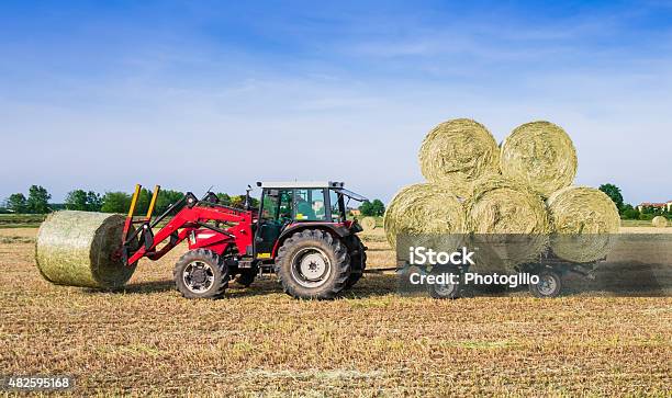Hay Harvesting Machine Stock Photo - Download Image Now - Bale, Grass, Mowing