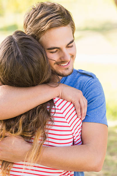 istock Cute couple hugging in the park 482596482
