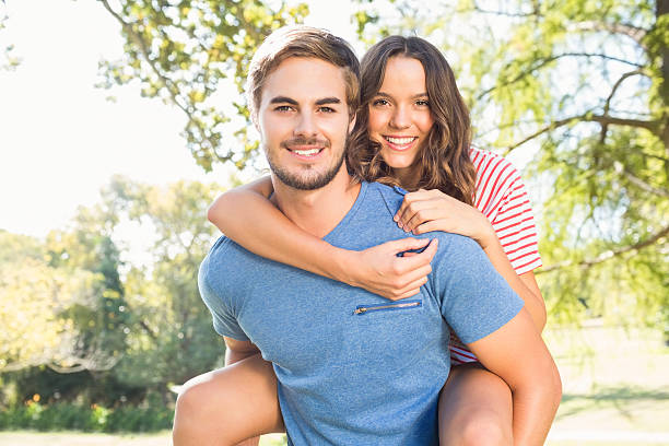 istock Cute couple having fun in park 482597454