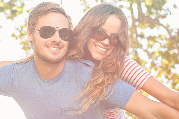 istock Cute couple having fun in park 482598052