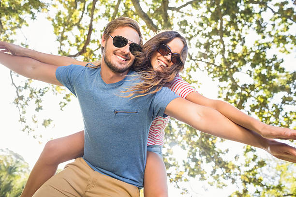 istock Cute couple having fun in park 482598066