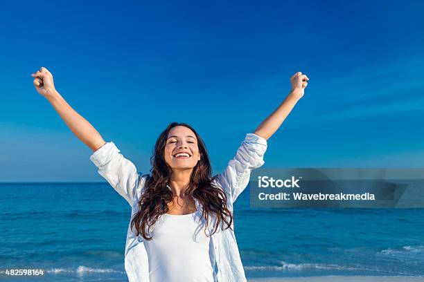 Happy Woman Smiling At The Beach Stock Photo - Download Image Now - 20-24 Years, 20-29 Years, 2015