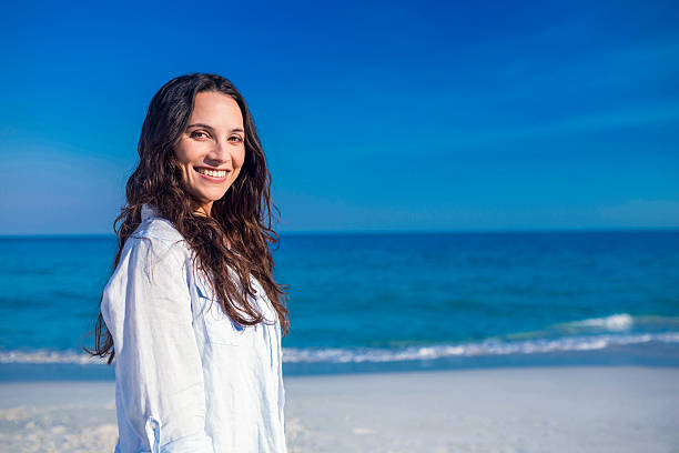 istock Happy woman at the beach 482598210