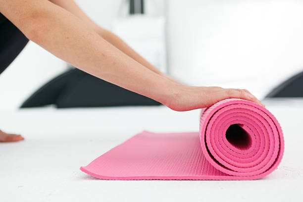 istock Young woman preparing for yoga. 482598548