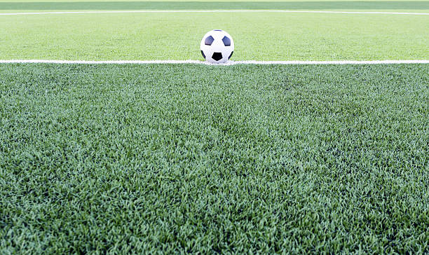 istock Soccer ball on the green field 482599477