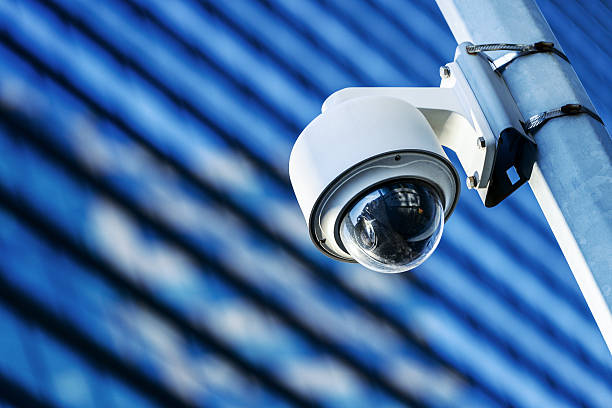 security camera and urban video security camera and urban video big brother orwellian concept photos stock pictures, royalty-free photos & images
