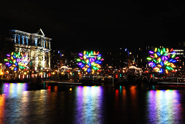 Amsterdam, Netherlands- January 06, 2014: Night view on the Amstel River of the art installation \