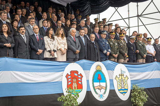 Córdoba, Argentina - April 2, 2014: Provincial authorities are in the official box, in the rain, doing a tribute to the Heroes of Córdoba Malvinas