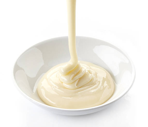 istock pouring condensed milk with sugar in a bowl 482602119
