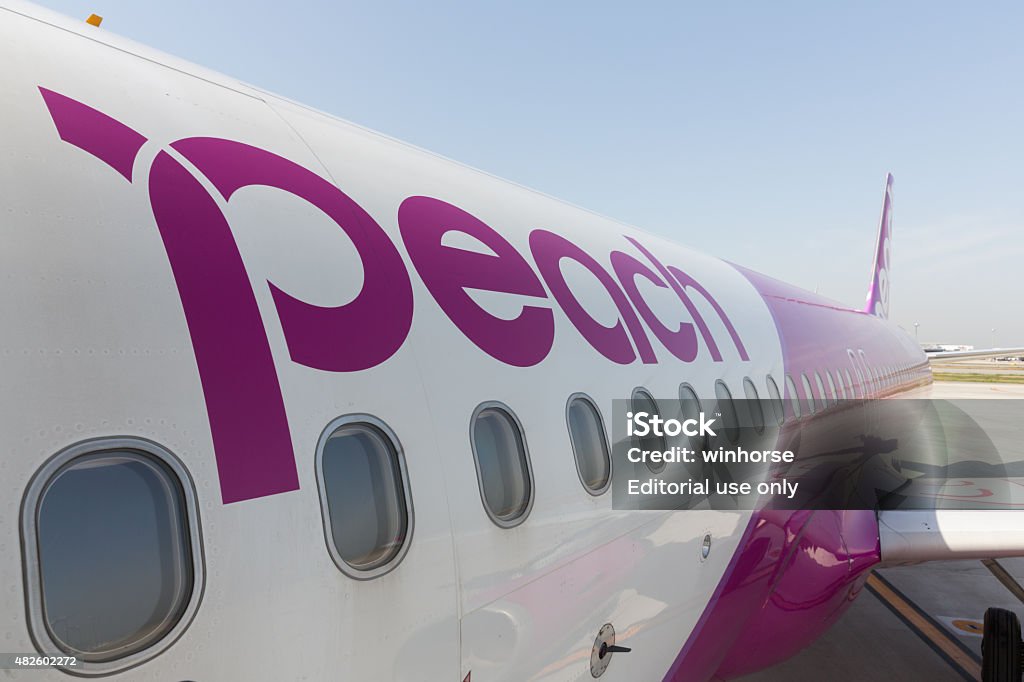 Peach Aviation Airbus A320 Osaka, Japan - April 18, 2015: Peach Aviation Airbus A320 at Kansai International Airport in Osaka, Japan. It is a low-cost airline based in Japan.  2015 Stock Photo