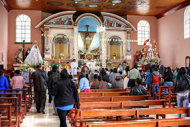 Recuay, Peru - January 24, 2015: Peruvian celebration of Little Jesus of Prague. Men, women and children crowd into church to celebrate the day