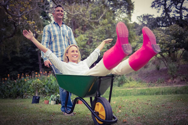 istock Happy couple playing with a wheelbarrow 482602588