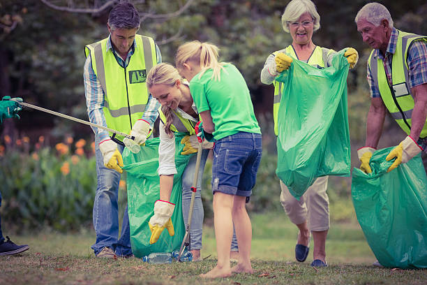 istock Happy family collecting rubbish 482602618