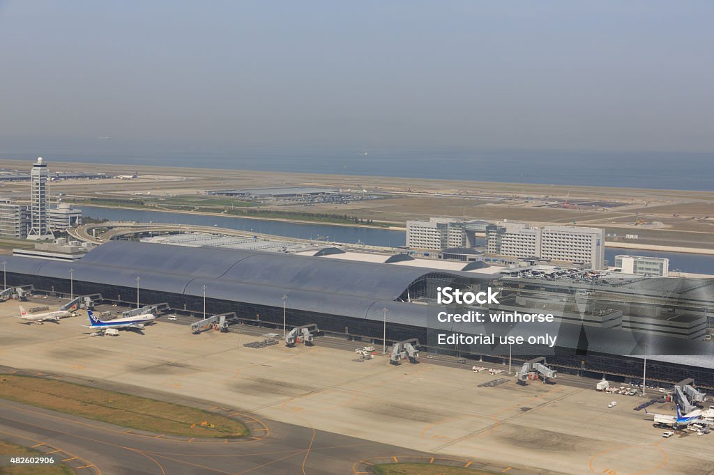 Kansai International Airport in Japan Osaka, Japan - April 18, 2015 : High angle view of Kansai International Airport. It is located on an artificial island in Osaka, Japan.  Airport Stock Photo