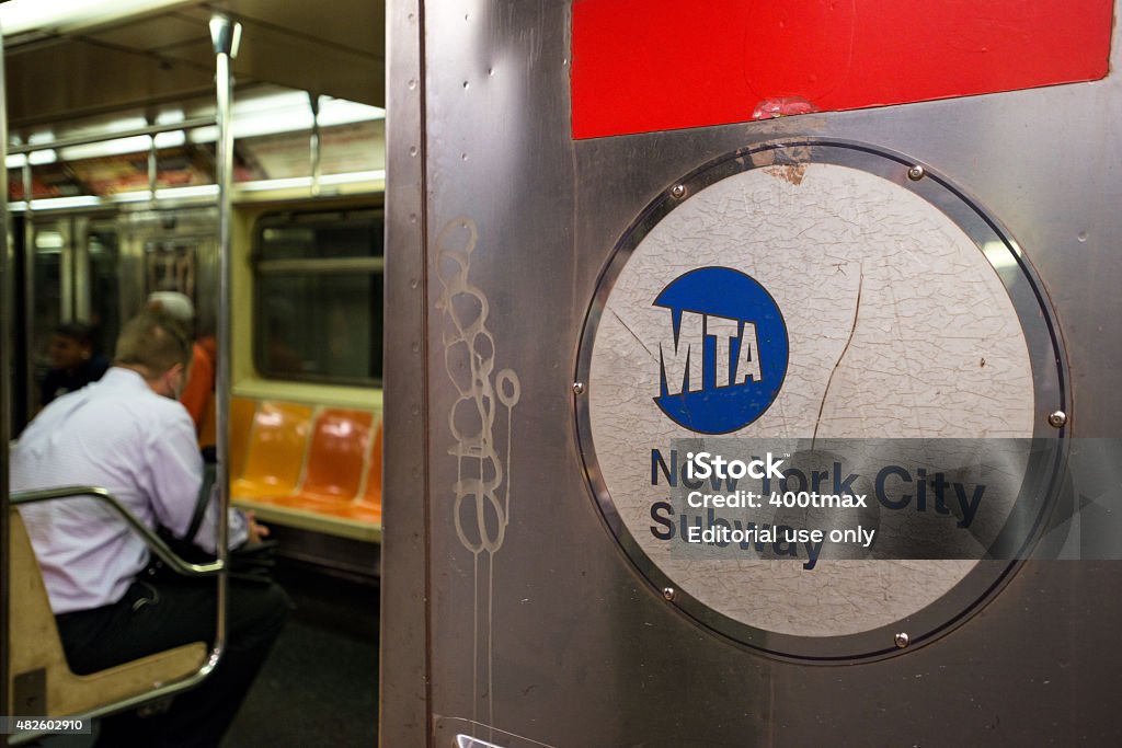 NYC Subway New York, USA - July 7, 2015: The Number One Redline Subway full of passengers late in the day preparing to leave the Times Square Platform in Manhattan. 2015 Stock Photo