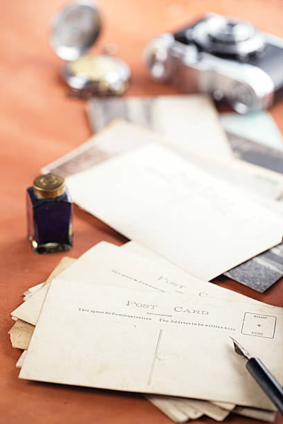 istock vintage ink pot with pen  and retro photographs 482603111