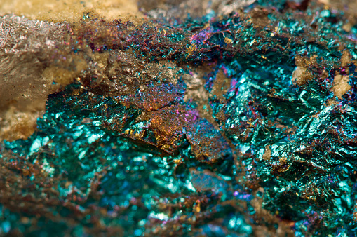 Magnified close up of a pegmatite rock with many colors.