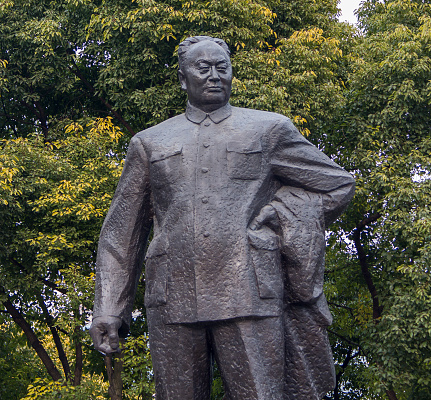 Shanghai, China - December 14, 2013: Statue of Chen Yi, first mayor of Shanghai on the Bund in Shanghai. This 5.6m high bronze sculpture was erected at 1993.