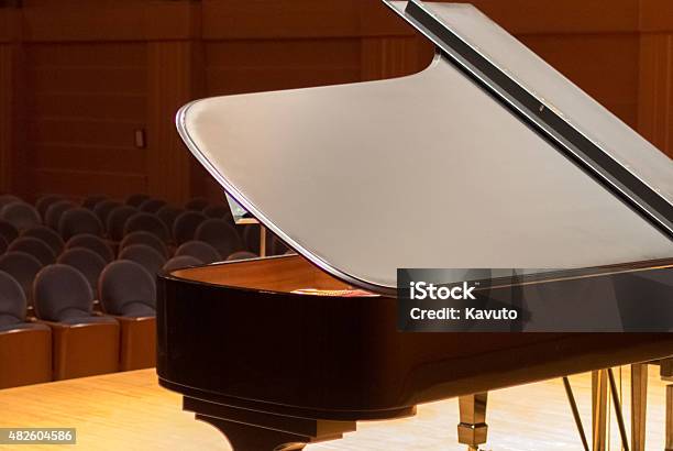 Piano Wating For The Opening Of Concert At Wooden Stage Stock Photo - Download Image Now