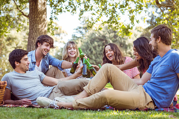 istock Happy friends in the park having picnic 482604796