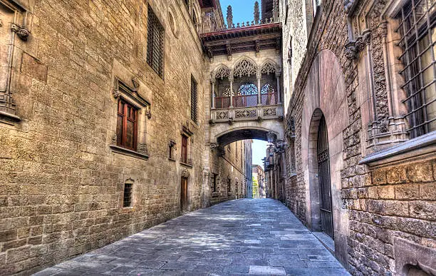 Flamboyant style bridge between buildings in El Bisbe street in the Gothic Quarter in central Barcelona, Spain