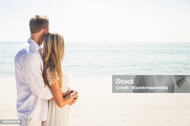 Happy Couple On The Beach Stock Photo - Download Image Now - 20-24 Years, 20-29 Years, 2015