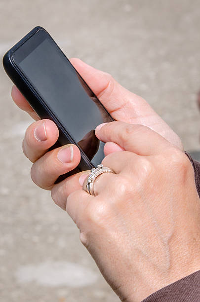 istock Young Woman Using her Smartphone Outdoor 482606912